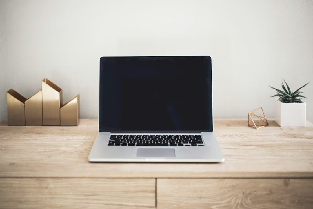 Laptop on a desk, illustrating a workspace for reviewing customer feedback