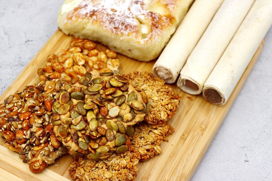 Illustrative stock photo of assorted pastries with nut and seed toppings