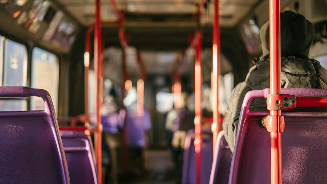 A passenger standing inside a transit vehicle, an illustrative stock photograph rather than an MTD bus