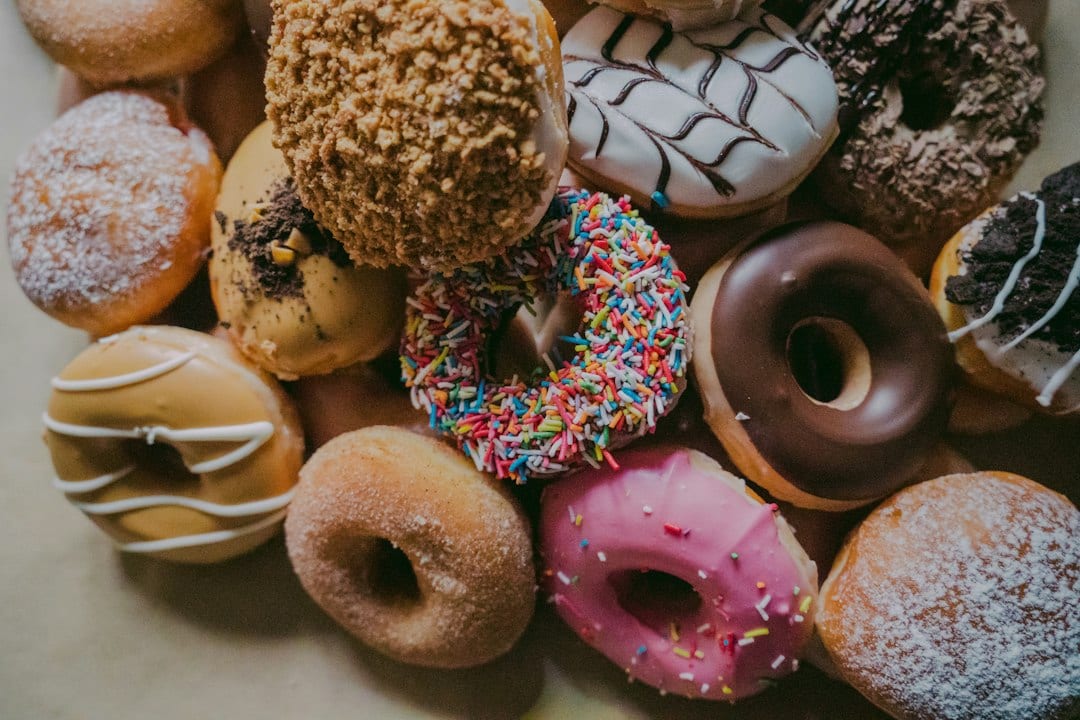 Illustrative bakery photograph of assorted donuts; not an image of The Donut Grove’s products