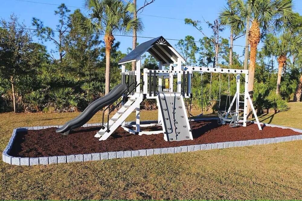 Florida Coastal with Heated Saltwater Pool on Two Lots with Huge New Playground