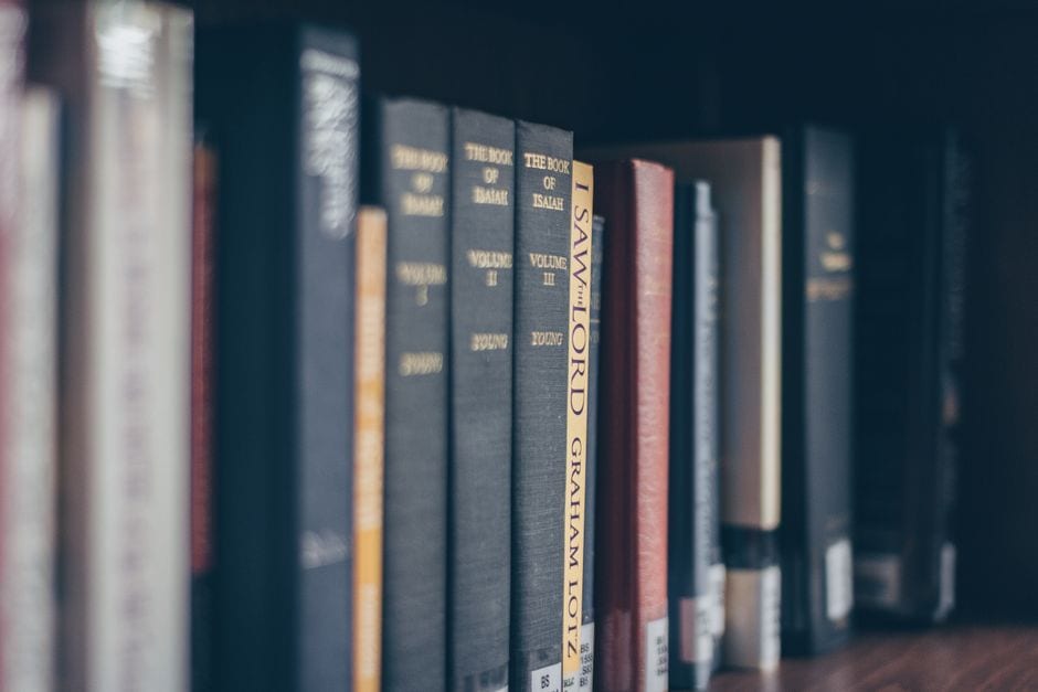 Illustrative books on a library shelf; not a participating museum photograph