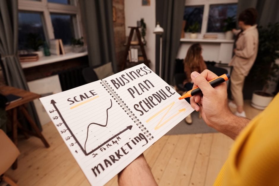 Illustrative stock photo of a notebook used for business planning, not a Champaign County SBDC advising session.